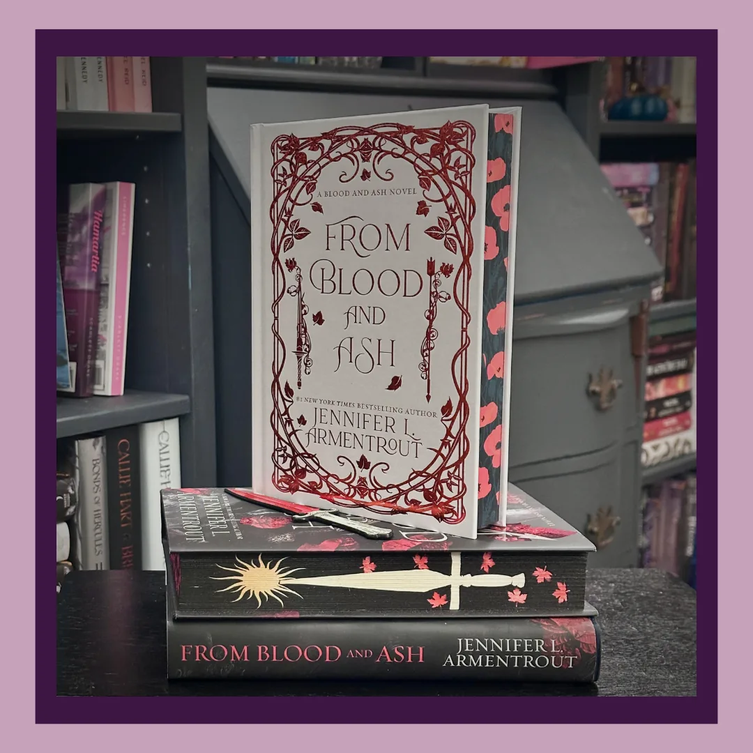 From Blood and Ash by Jennifer L. Armentrout, three editions. A white hardcover with red foil and red flowers on the edges, standing on a hardcover with a sword painted along the edges and the original hardcover.